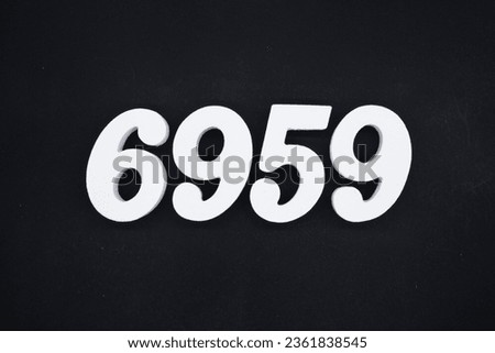 Black for the background. The number 6959 is made of white painted wood.