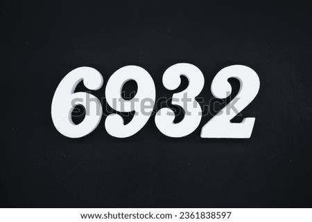 Black for the background. The number 6932 is made of white painted wood.