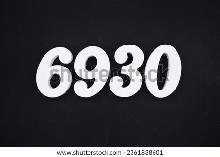 Black for the background. The number 6930 is made of white painted wood.