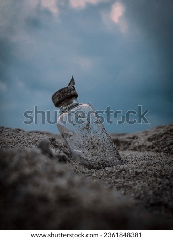 A mystery glass bottle in a beach