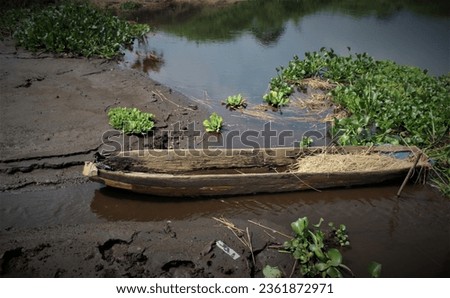 Abandoned Old Wooden Boat in the river