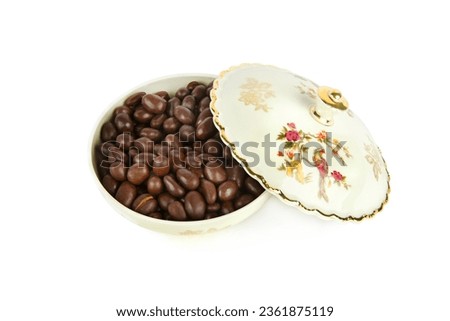 Porcelain box with chocolate dragee isolated on a white background. German vintage porcelain. Royalty-Free Stock Photo #2361875119