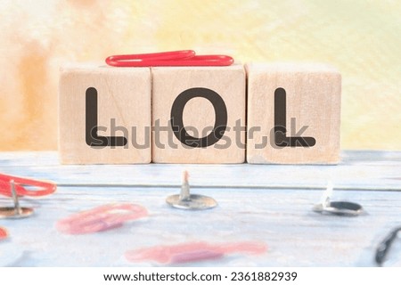 LOL. Cubes form the word LOL. Concept LOL - laughing out loud Royalty-Free Stock Photo #2361882939