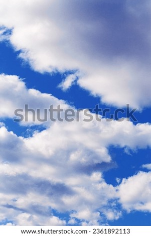 Blue sky with white clouds, bright colored cloudscape. Fluffy heaven pattern, aesthetic natural scene. Beautiful Cloudy background, nature environment backdrop, wallpaper, phone screensaver