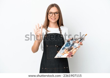 Young artist Lithuanian woman holding a palette isolated on white background happy and counting four with fingers