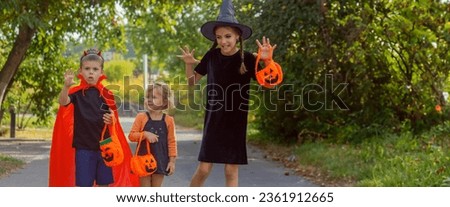 Children dressed in costumes for Halloween night. Selective focus. Halloween