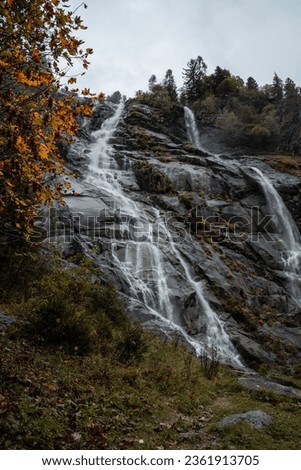 The Nardis Waterfall in Trentino Alto Adige during a foggy and rainy day in autumn, Northern Italy	 Royalty-Free Stock Photo #2361913705