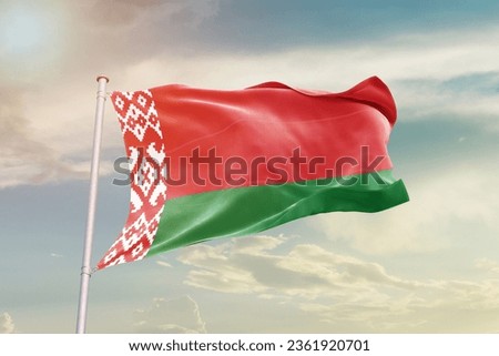 Belarus national flag waving in beautiful sky.