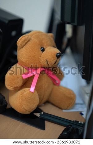 Teddy bear doll sit on the table