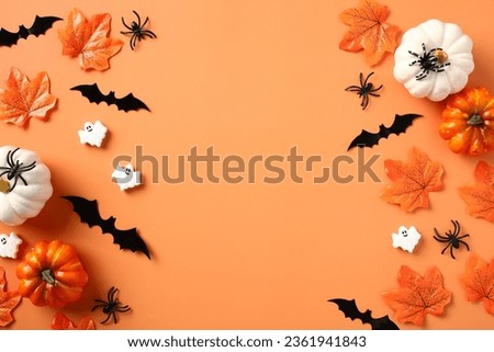 Halloween holiday background with pumpkins, bats, maple leaves, spiders. Halloween party invitation design.