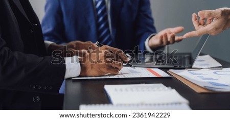 business adviser meeting to analyze and discuss the situation on the financial report in the meeting room.Investment Consultant, Financial advisor and accounting concept	