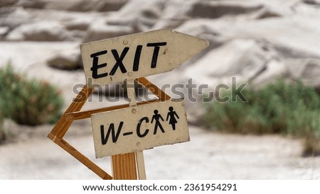 Exit and toilet signs at an Egyptian temple site