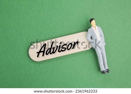 miniature people and a wooden board with the word advisor. advisory concept