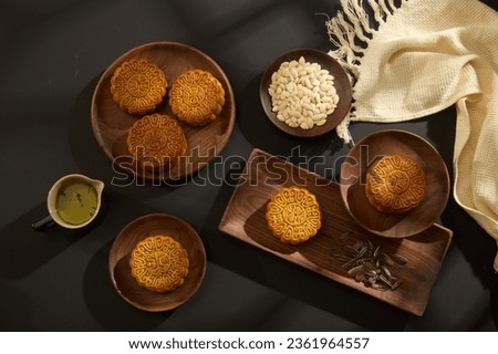 Chinese Mid-Autumn Festival concept made from mooncakes on wooden trays. Mid-Autumn Festival is a long-standing meaningful custom not only in Vietnam and China but also in other countries in Asia.