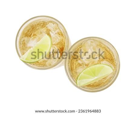 Glasses of tasty ginger ale with ice cubes and lime slices isolated on white, top view Royalty-Free Stock Photo #2361964883