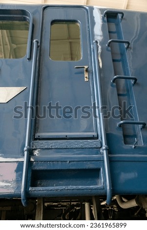 Abstract transportation or technology or transportation dark vintage background featuring detail of aged Japanese train car in Kyoto, Japan.