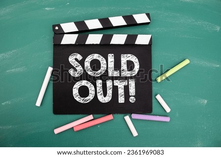 SOLD OUT. Movie clapper and colored pieces of chalk.