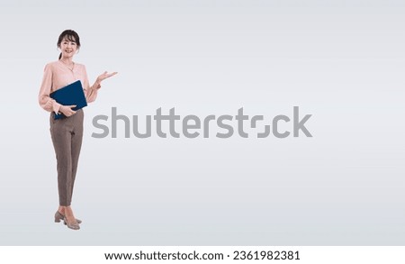 Asian middle-aged woman guiding with document file. Royalty-Free Stock Photo #2361982381