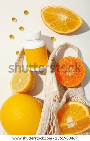 Bio-supplement vitamin C, in tablets on a light background.