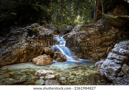 A small waterfall in a small stream on the Ra Gores de Federa path from Cortina d'Ampezzo to Malga Federa in South Tyrol - Dolomites in Italy. Royalty-Free Stock Photo #2361984827