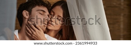 romantic couple, pretty woman seducing man in white clothes and sitting in private pavilion, banner