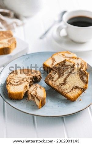 Marble sponge cake. Cake with cocoa and vanilla taste on the plate. Royalty-Free Stock Photo #2362001143