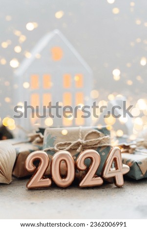 Christmas and New Year card. Number 2024 on holiday background. Christmas lights bokeh background. Holiday postcard. Happy New Year 2024 Card Concept. Royalty-Free Stock Photo #2362006991