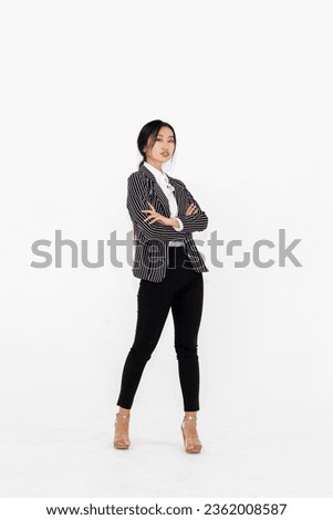 Asian woman full body portrait on white background wearing formal business suit . Jivy Royalty-Free Stock Photo #2362008587