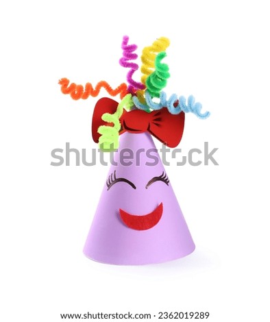 Bright party hat with funny face isolated on white. Handmade decoration Royalty-Free Stock Photo #2362019289
