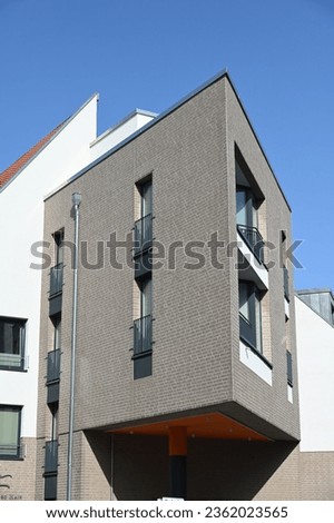 Bückeburg, Germany - September 10, 2023: Multi-story residential building with a strikingly acute-angled corner Royalty-Free Stock Photo #2362023565