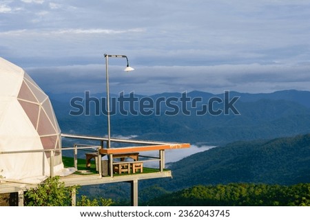 Dome tent for camping and beautiful landscape on hill in rainy season at Mon Jam, Chiang Mai, Thailand. Geo dome tents. Outdoors cabin.Cozy, camping, glamping, holiday, vacation lifestyle concept. Royalty-Free Stock Photo #2362043745
