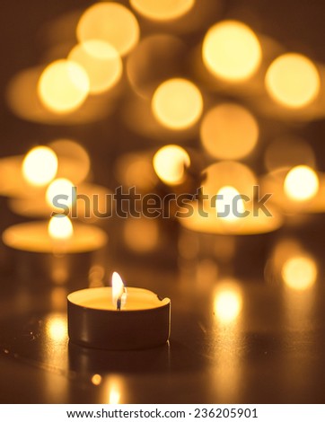 Vertical picture of bokeh tea candles