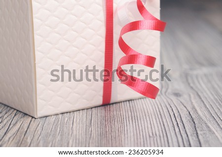 Curly ribbon and textured white box