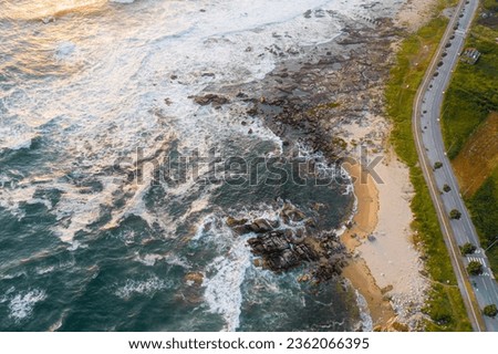 Drone aerial photo of a rocky coastline and a road