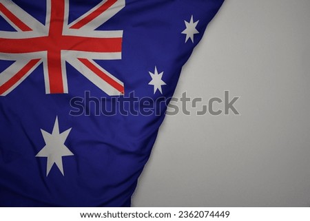 big waving national colorful flag of australia on the gray background. macro