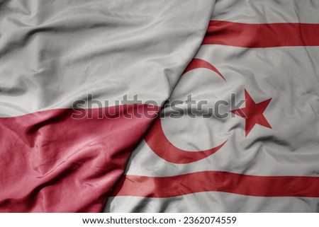 big waving national colorful flag of poland and national flag of northern cyprus . macro