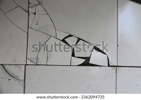 broken ceramic floors due to uneven soil structure Royalty-Free Stock Photo #2362094735