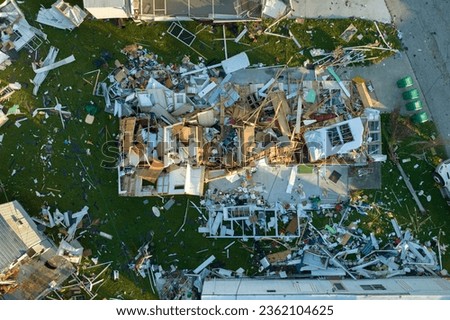 Consequences of natural disaster in southern Florida after hurricane season. Severely damaged houses in mobile home residential area Royalty-Free Stock Photo #2362104625