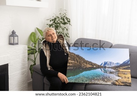 Canvas print with gallery wrap. old woman with photo canvas