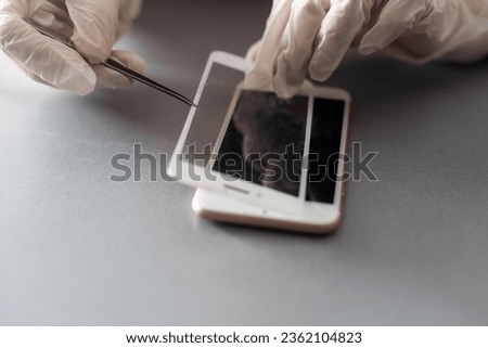 Technician prepairing to repair and replace new screen broken and cracked screen smartphone prepairing on desk.
