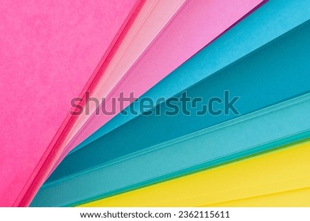 Colored paper in bright tones and spread out Royalty-Free Stock Photo #2362115611