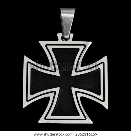 A pendant in the form of a Maltese cross. Accessory for rockers, metalheads, punks, goths.
