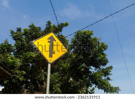 a road sign that indicates there will be a crossroads