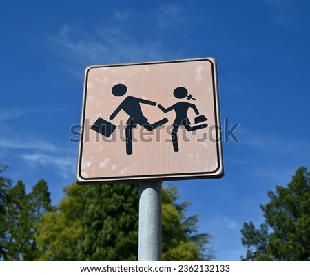White Square Sign With Boy And Girl Running Silhouettes