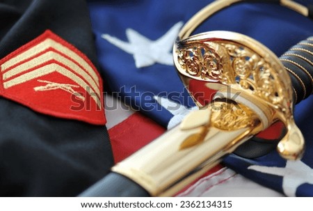 Marine Corps sabre, white gloves, and American flag. Royalty-Free Stock Photo #2362134315