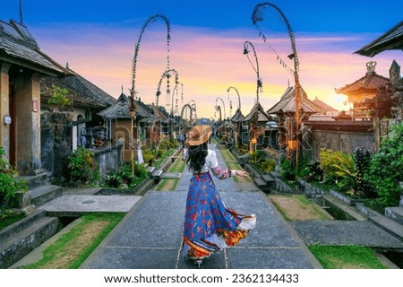 Tourist walking at Penglipuran village is a traditional oldest Bali village in Bali, Indonesia. Royalty-Free Stock Photo #2362134433