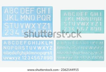 four blue alphabet rulers of different sizes, from small to large