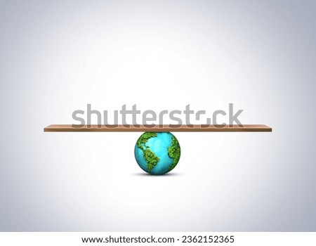 Globe Balancing concept. Carbon Neutral and ESG Concepts. Carbon Emission, Clean Energy. Sustainable Resources, Concern about Environmental.  Royalty-Free Stock Photo #2362152365