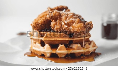 Fried Chicken and Waffles Platter with a Drizzle of Syrup Royalty-Free Stock Photo #2362152543