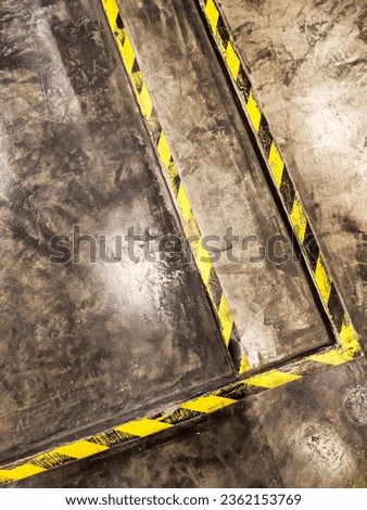Ho Chi Minh, Vietnam - July 21 2022: Guiding Pathways: Cement Staircases and Floors Adorned with Safety Strips Signaling Hospitality in Building Interiors
